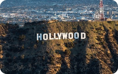 Aerial view of the Hollywood Sign surrounded by Los Angeles hills
